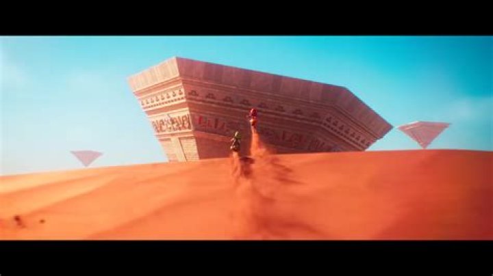 What is the giant coin slot before the boss area in the Sand Kingdom?